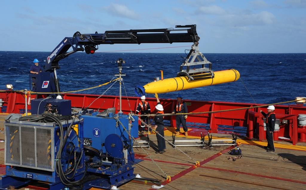 this handout image taken on april 1 2014 and received on april 8 2014 from the us navy shows the bluefin 21 artemis autonomous underwater vehicle auv being hoisted back on board the australian navy vessel ocean shield after successful buoyancy testing in the indian ocean photo afp