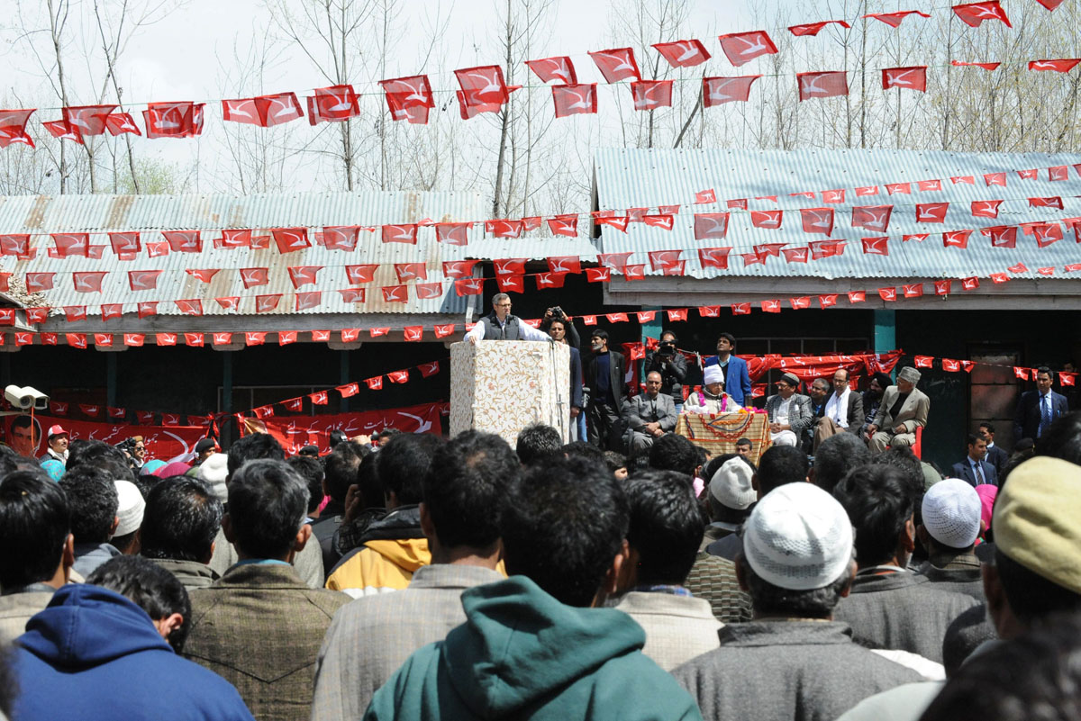 jammu and kashmir chief minister omar abdullah c whose father farooq abdullah is contesting srinagar 039 s seat for the lower house of parliament in india 039 s general election addresses an election rally on the outskirts of srinagar on april 8 2014 photo afp