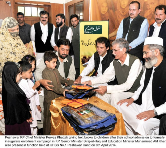 cm khattak distributing books among freshly enrolled students photo courtesy k p directorate of information cm khattak distributing books among freshly enrolled students photo courtesy k p directorate of information