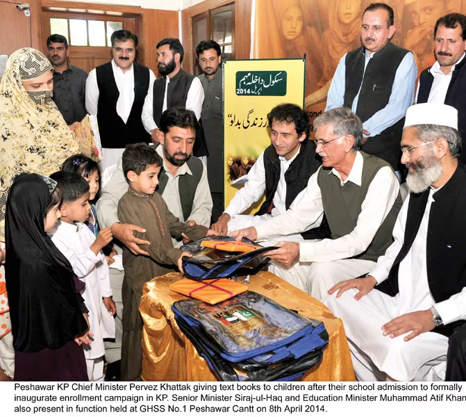 cm khattak distributing books among freshly enrolled students photo courtesy k p directorate of information cm khattak distributing books among freshly enrolled students photo courtesy k p directorate of information