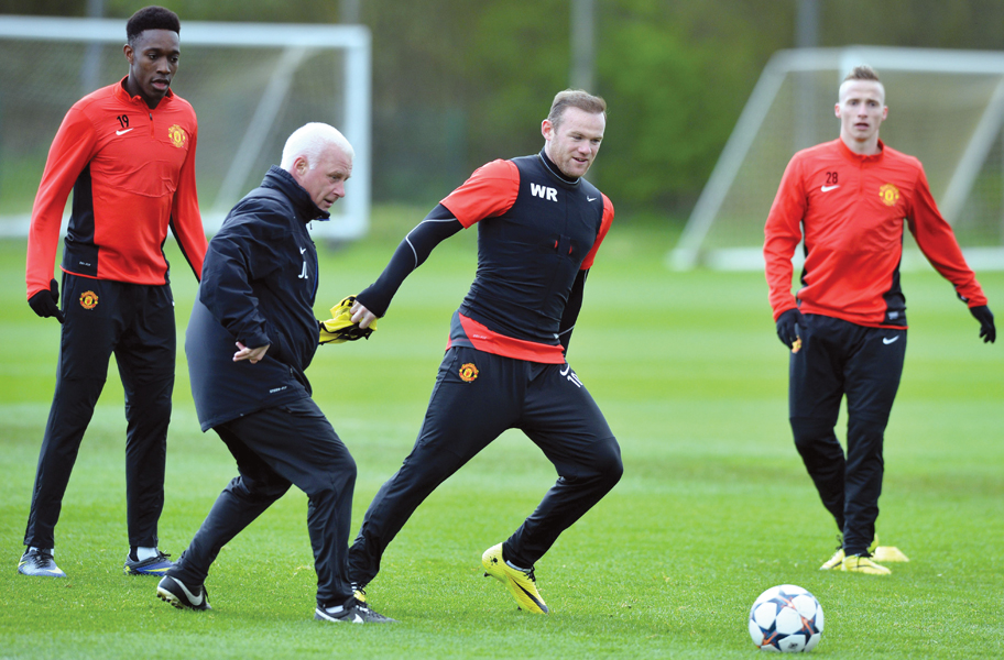 manchester united striker wayne rooney allayed worries about his fitness by taking part in training on tuesday ahead of his side s champions league quarter final second leg at bayern munich photo afp