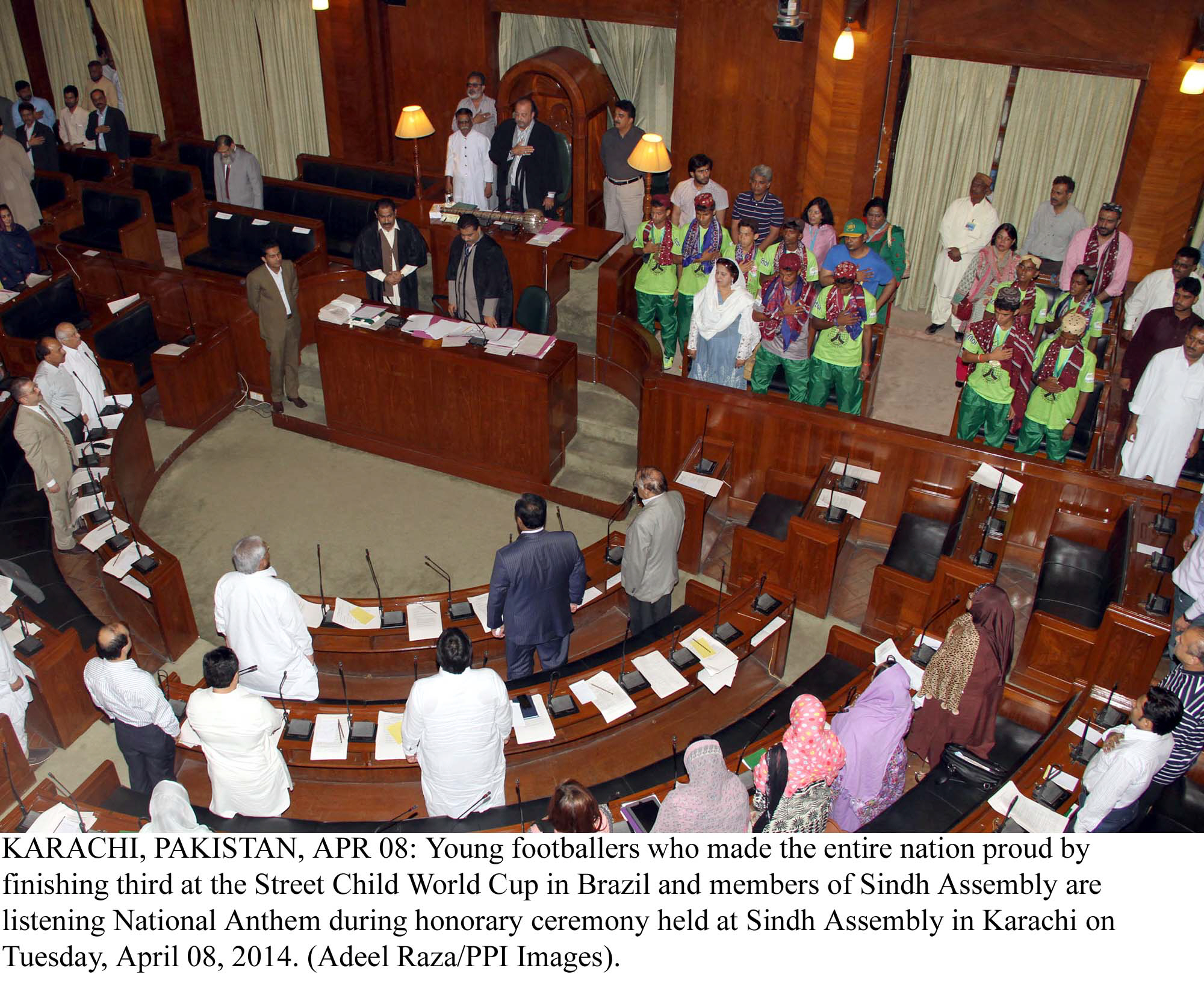 sindh assembly members and street football players stand as the national anthem is played photo ppi