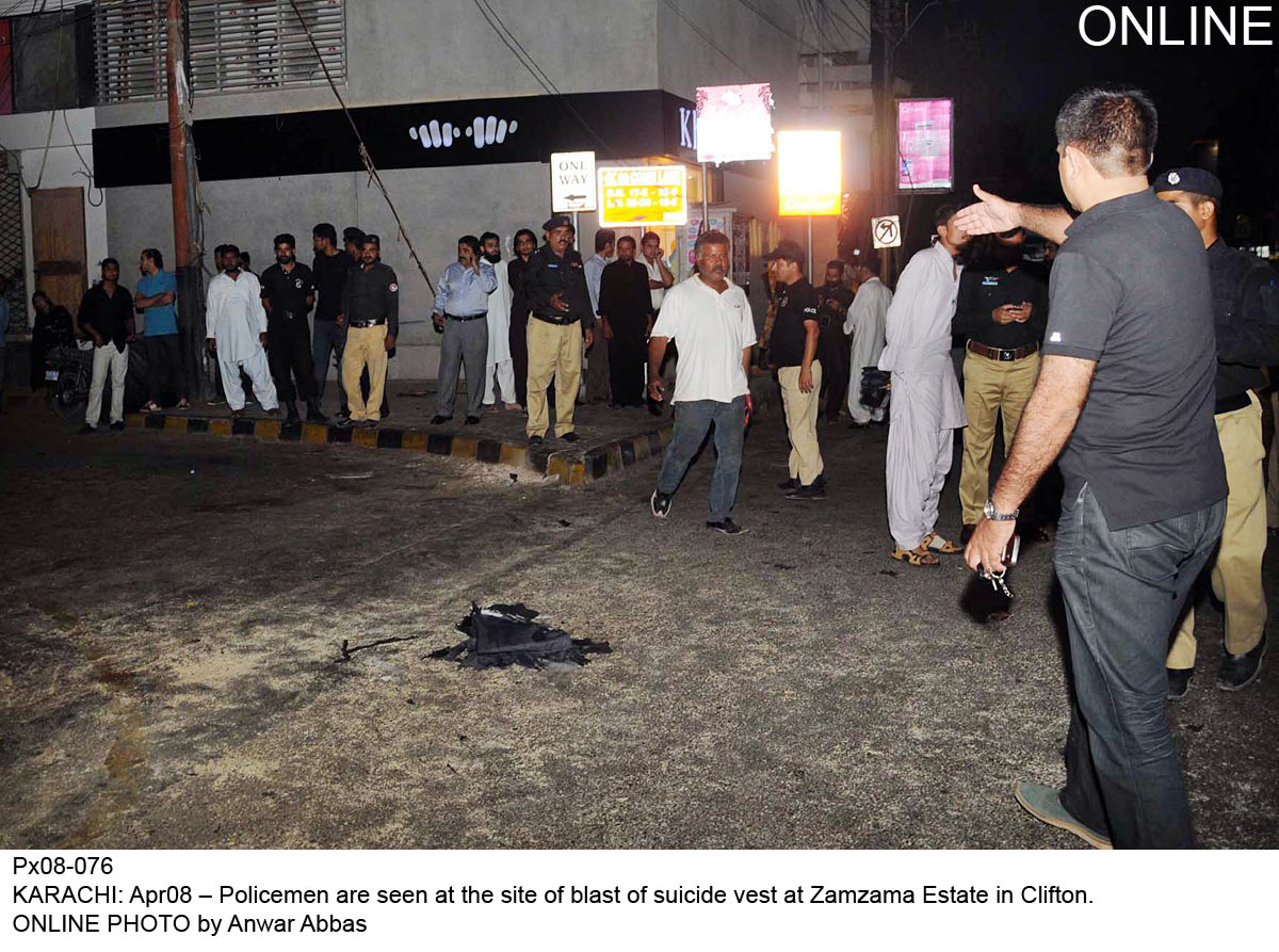 officials gather at the scene of a blast in zamzama commercial area on tuesday evening photo online