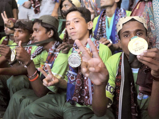 street footballers arrive at the sindh assembly building to attend a reception photo afp