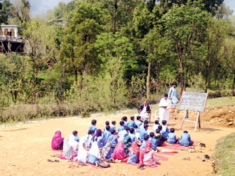 students take class in the open in battal village of kotli district in azad kashmir photo express