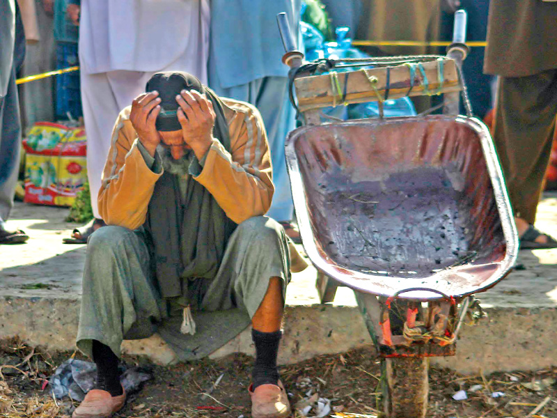 a vegetable vendor mourns at the site of the blast in islamabad photo muhammad javaid