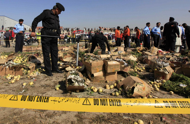 a police official uses a metal detector to search the site of a bomb blast at a vegetable and fruit market in the outskirts of islamabad april 9 2014 photo reuters a police official uses a metal detector to search the site of a bomb blast at a vegetable and fruit market in the outskirts of islamabad april 9 2014 photo reuters