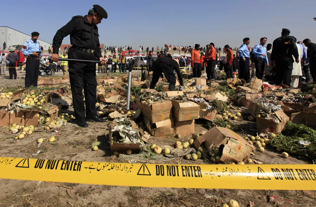a police official uses a metal detector to search the site of a bomb blast at a vegetable and fruit market in the outskirts of islamabad april 9 2014 photo reuters a police official uses a metal detector to search the site of a bomb blast at a vegetable and fruit market in the outskirts of islamabad april 9 2014 photo reuters