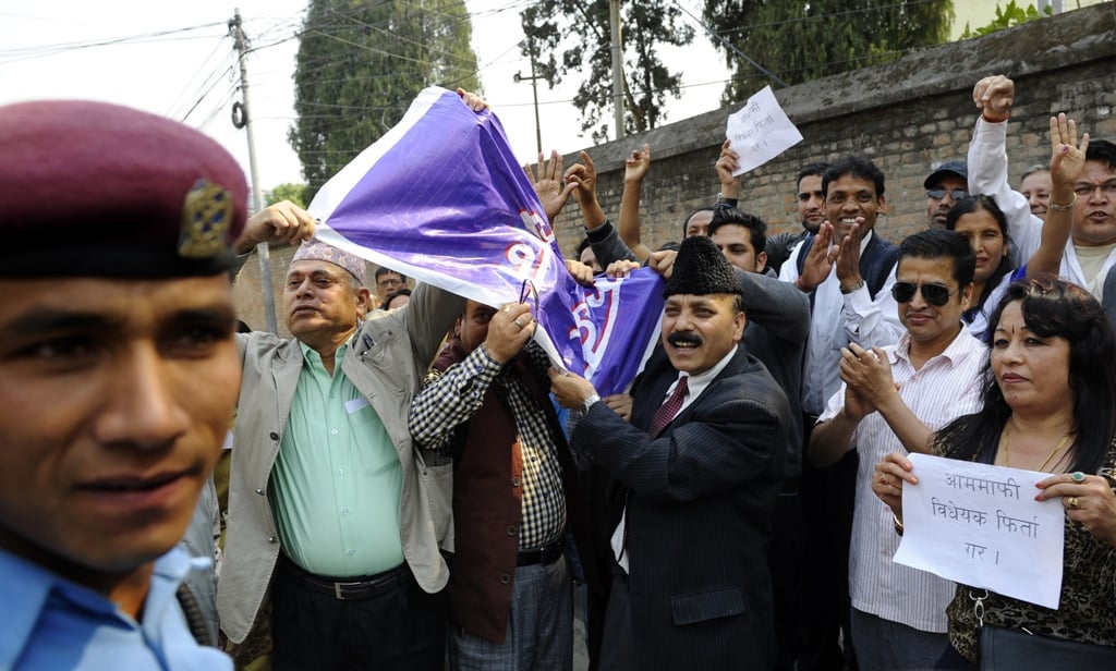 nepalese victims of war and human rights activists chant anti goverment slogans during a protest in front of government offices in kathmandu photo afp