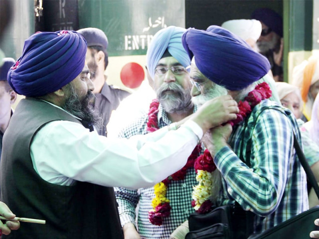 gurdwara parbandhak committee members welcome visitors with flower garlands photo shafiq malik express gurdwara parbandhak committee members welcome visitors with flower garlands photo shafiq malik express