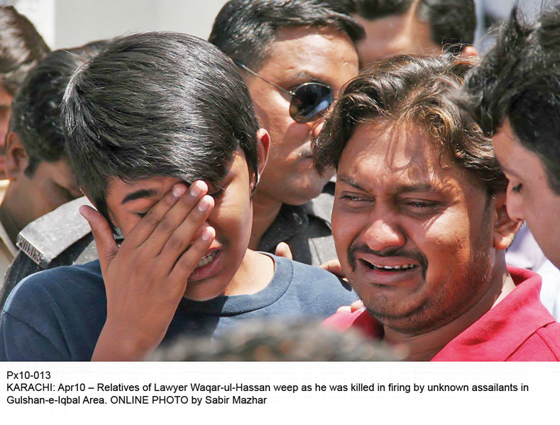 relatives of slain lawyer syed waqarul hassan shah weep after receiving news of the incident photo online