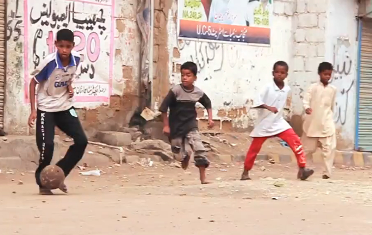 this screenshot from one of the films made by young filmmakers on lyari shows children playing football on the streets of lyari