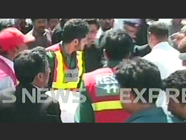 express news screengrab of rescue 1122 workers moving one of the bodies