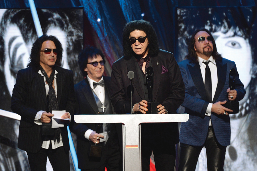 kiss founding member gene simmons mentioned by name the band s current members eric singer and tommy thayer who were not honoured by the hall photos file