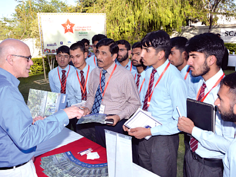 a us college representative explains procedures while giving out prospectuses photo express