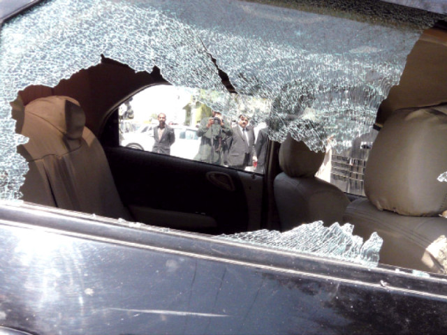 the bullet riddle car with shattered glass windows photo inp the bullet riddle car with shattered glass windows photo inp