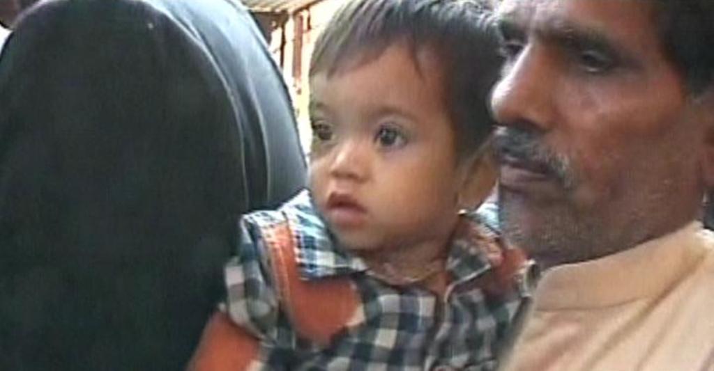 express news screengrab of the 9 month old baby and his grandfather