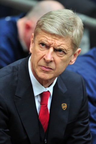 arsenal manager arsene wenger believes his squad can keep up the momentum from their fa cup victory over wigan to finish top four in the premier league photo afp arsenal manager arsene wenger believes his squad can keep up the momentum from their fa cup victory over wigan to finish top four in the premier league photo afp
