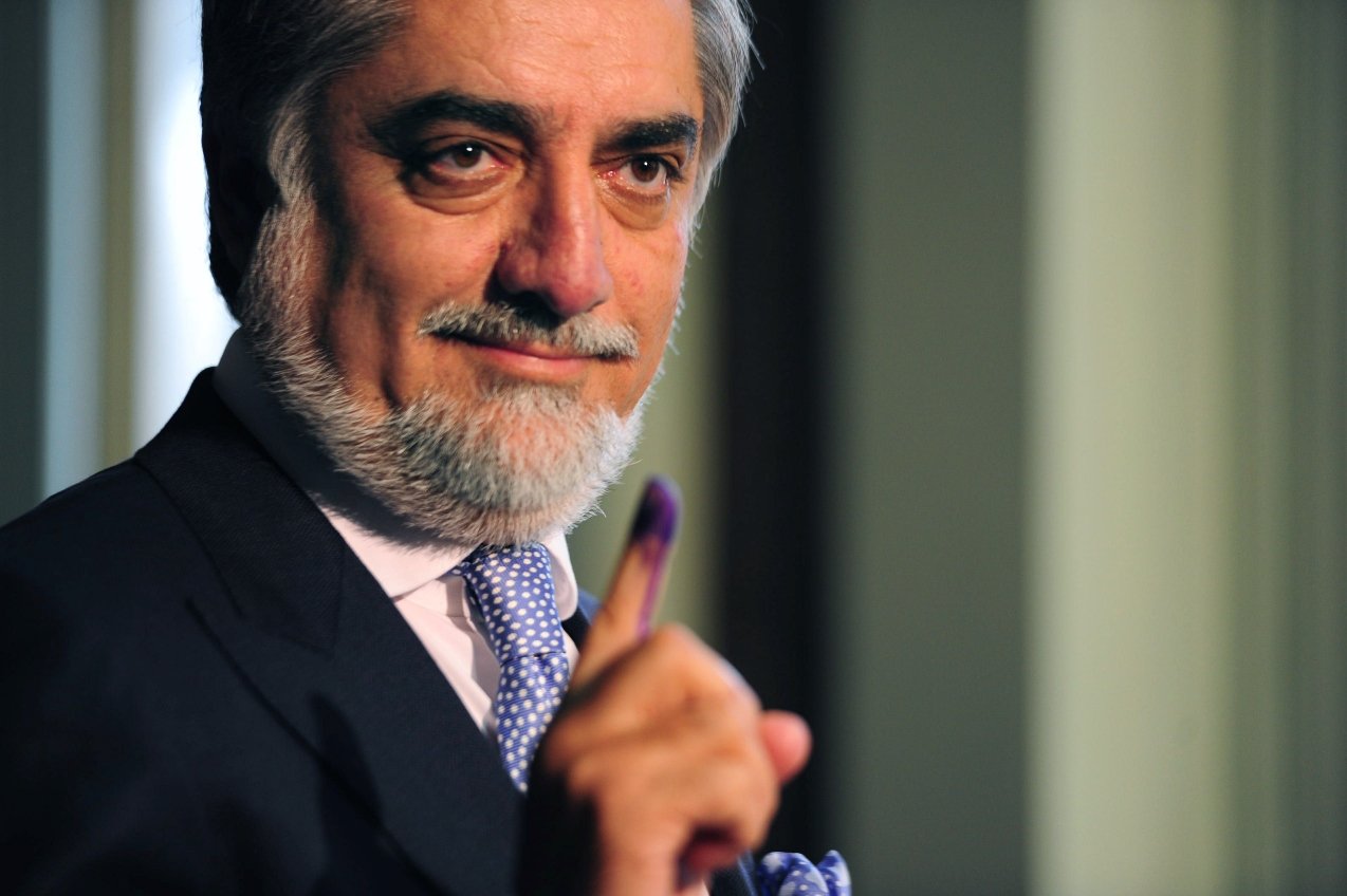 afghan presidential candidate abdullah abdullah shows his inked finger as he casts his vote at a local polling station in kabul on april 5 2014 photo afp