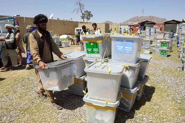 afghan election commission workers unload ballot boxes photo afp