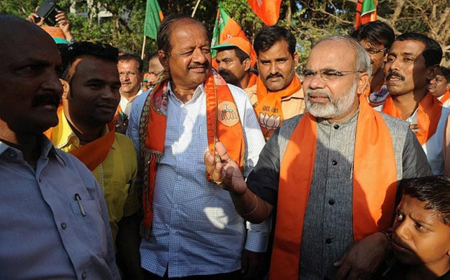 mahante s uncanny resemblance to modi has made him a permanent face in the city s bjp campaign rallies and roadshow photo afp mahante s uncanny resemblance to modi has made him a permanent face in the city s bjp campaign rallies and roadshow photo afp