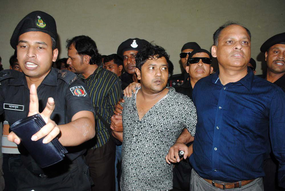 bangladeshi property tycoon sohel rana c is presented at a press conference at the rapid action battalion rab headquarters in dhaka photo afp