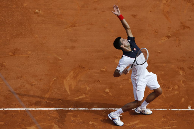 serbia 039 s novak djokovic serves during a monte carlo atp masters series tournament tennis match against spain 039 s albert montanes on april 15 2014 in monaco photo afp serbia 039 s novak djokovic serves during a monte carlo atp masters series tournament tennis match against spain 039 s albert montanes on april 15 2014 in monaco photo afp