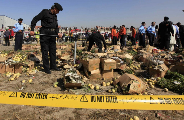 a police official uses a metal detector to search the site of a bomb blast at a vegetable and fruit market in the outskirts of islamabad april 9 2014 photo reuters a police official uses a metal detector to search the site of a bomb blast at a vegetable and fruit market in the outskirts of islamabad april 9 2014 photo reuters