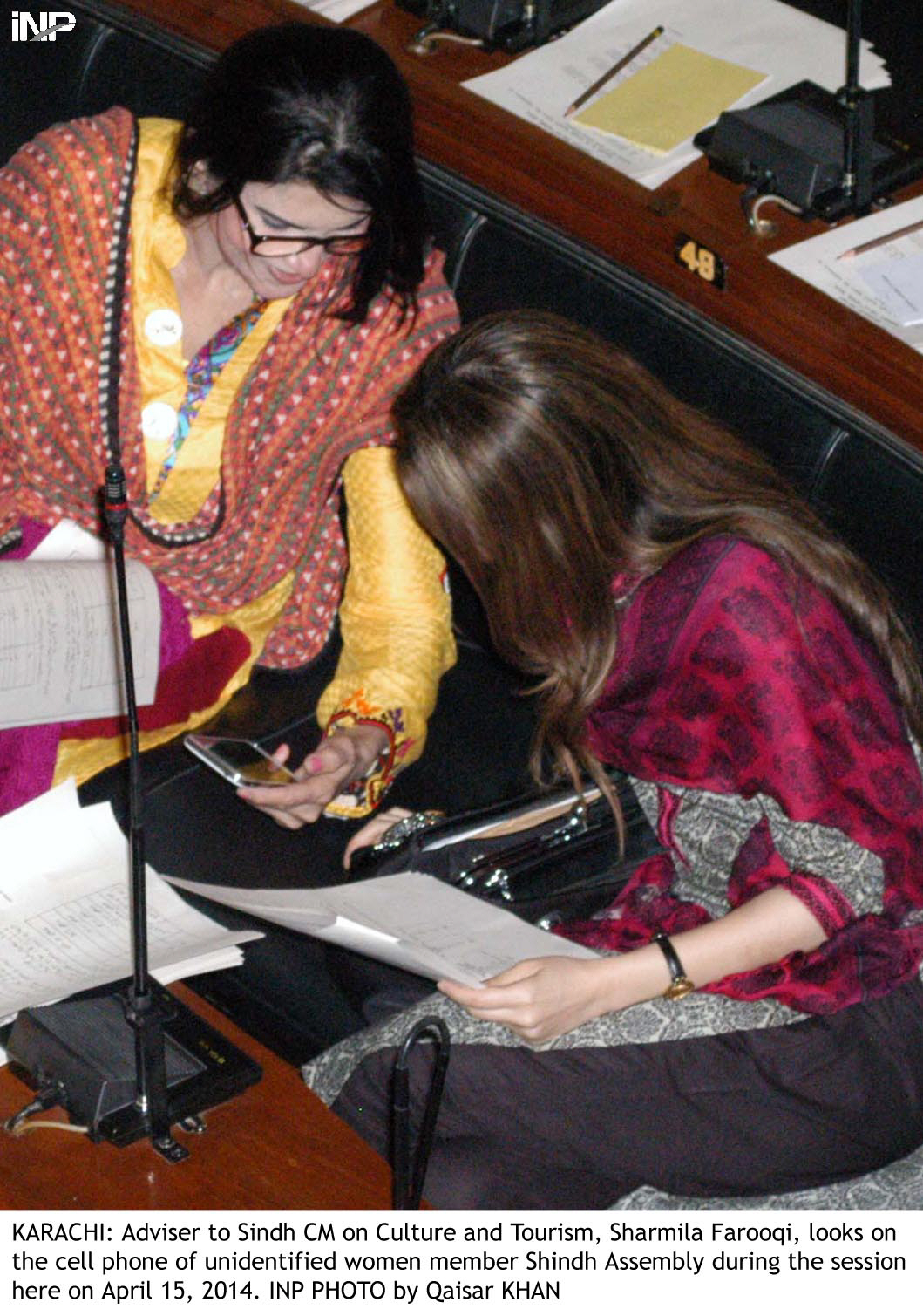 two women parliamentarians of the sindh assembly share a light moment away from the proceedings of the house photo inp