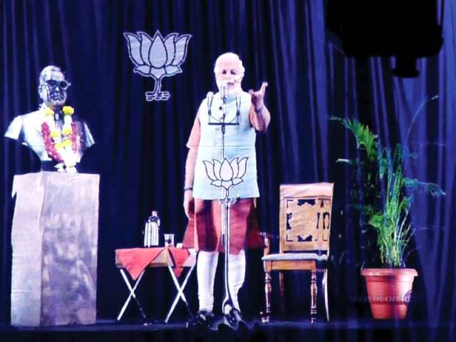 a 3d hologram image of narendra modi is pictured during a live telecast in mumbai photo afp a 3d hologram image of narendra modi is pictured during a live telecast in mumbai photo afp