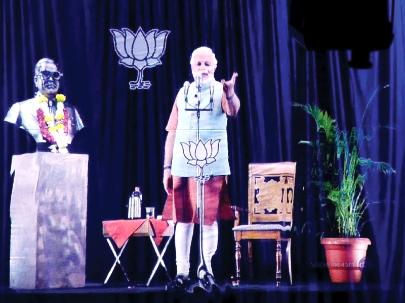 a 3d hologram image of narendra modi is pictured during a live telecast in mumbai photo afp