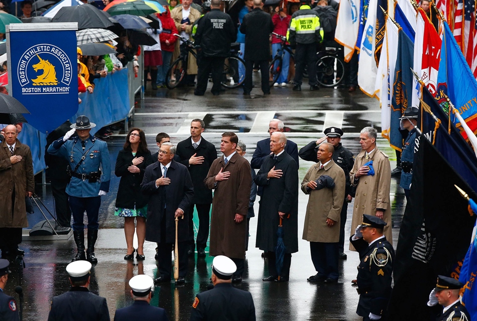 boston ma   april 15 l r former boston mayor thomas menino boston mayor marty walsh u s vice president joe biden massachusetts governor deval patrick and tom grilk executive director boston athletic association stand together during 039 god bless america 039 at the flag raising ceremony commemorating the one year anniversary of the boston marathon bombings on boylston street near the finish line on april 15 2014 in boston massachusetts last year two pressure cooker bombs killed three and injured an estimated 264 others during the boston marathon on april 15 2013 photo afp