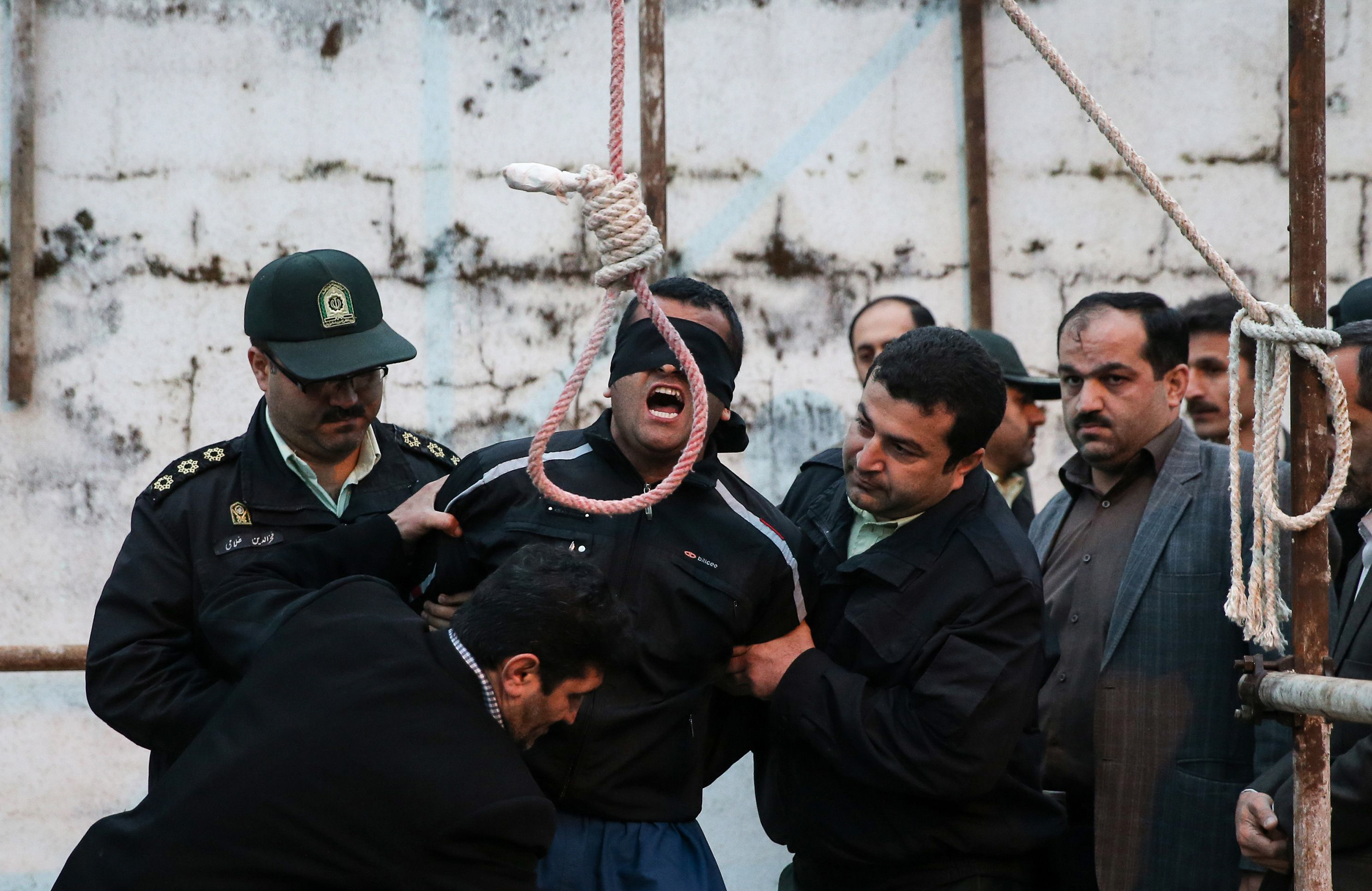 balal who killed an iranian youth abdolah hosseinzadeh in a street fight with a knife in 2007 is brought to the gallows during his execution ceremony in the northern city of nowshahr on april 15 2014 the mother of abdolah hosseinzadeh spared the life of balal her son 039 s convicted murderer with an emotional slap in the face as he awaited execution prior to removing the noose around his neck photo afp