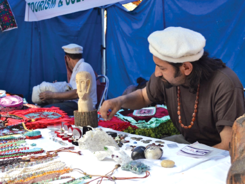 artisans from gilgit baltistan displaying their products at lok mela in shakarparian on thursday photo express