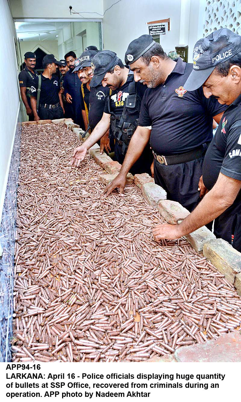 police officials in larkana display the large cache of ammunition they found photo app