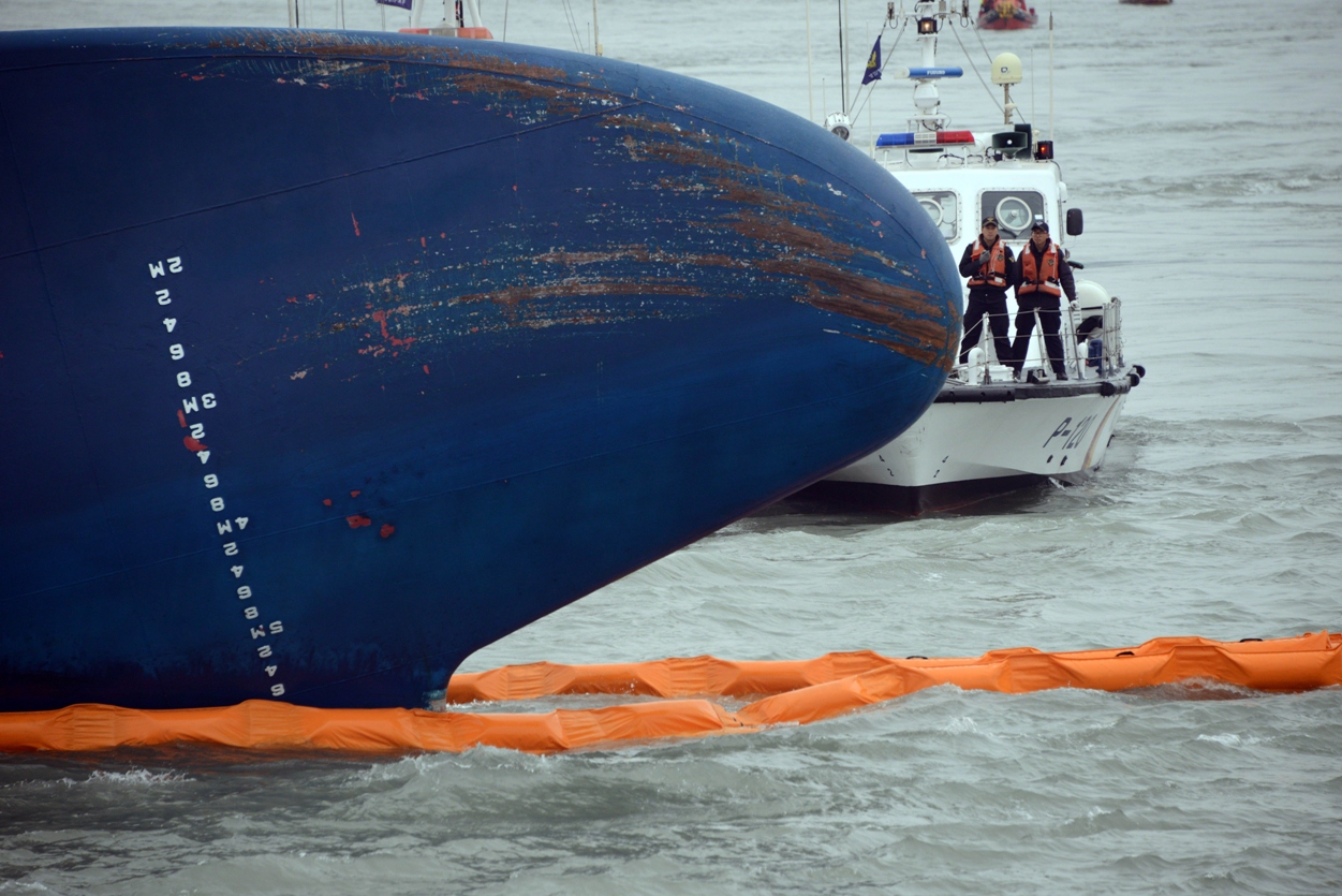 coast guard members search for passengers near a south korean ferry that capsized on its way to jeju island in jindo on april 17 2014 photo afp file