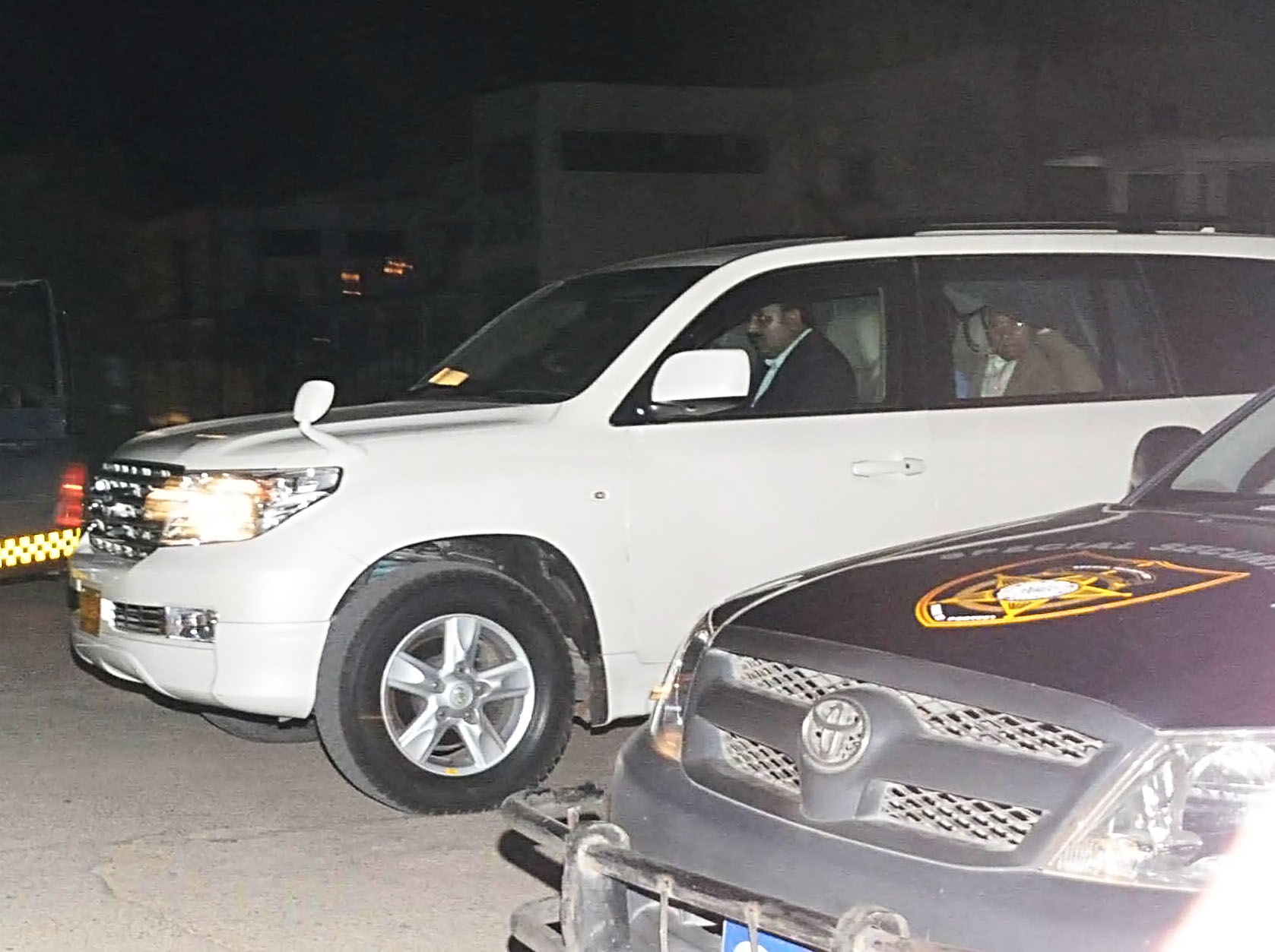 former president pervez musharraf peeks through the curtains of his bomb proof suv as he arrives at a bunglow of zamzama on saturday evening photo mohammad noman express