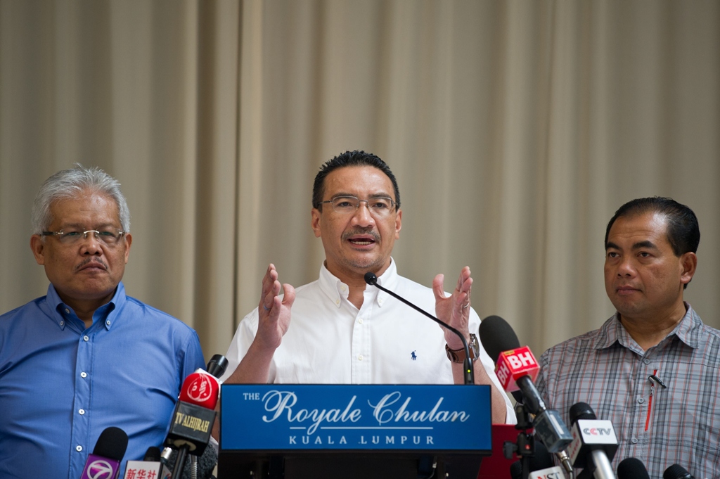 malaysian minister of defence and acting transport minister hishammuddin hussein c speaks during a press conference at a hotel in kuala lumpur photo afp