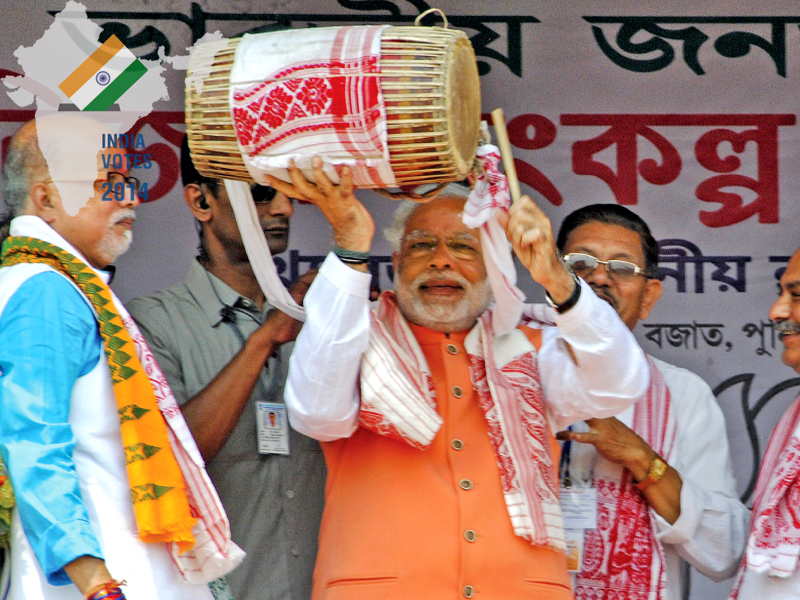 narendra modi plays a dhol during an election campaign rally in mangaldoi in the northeastern indian state of assam photo reuters