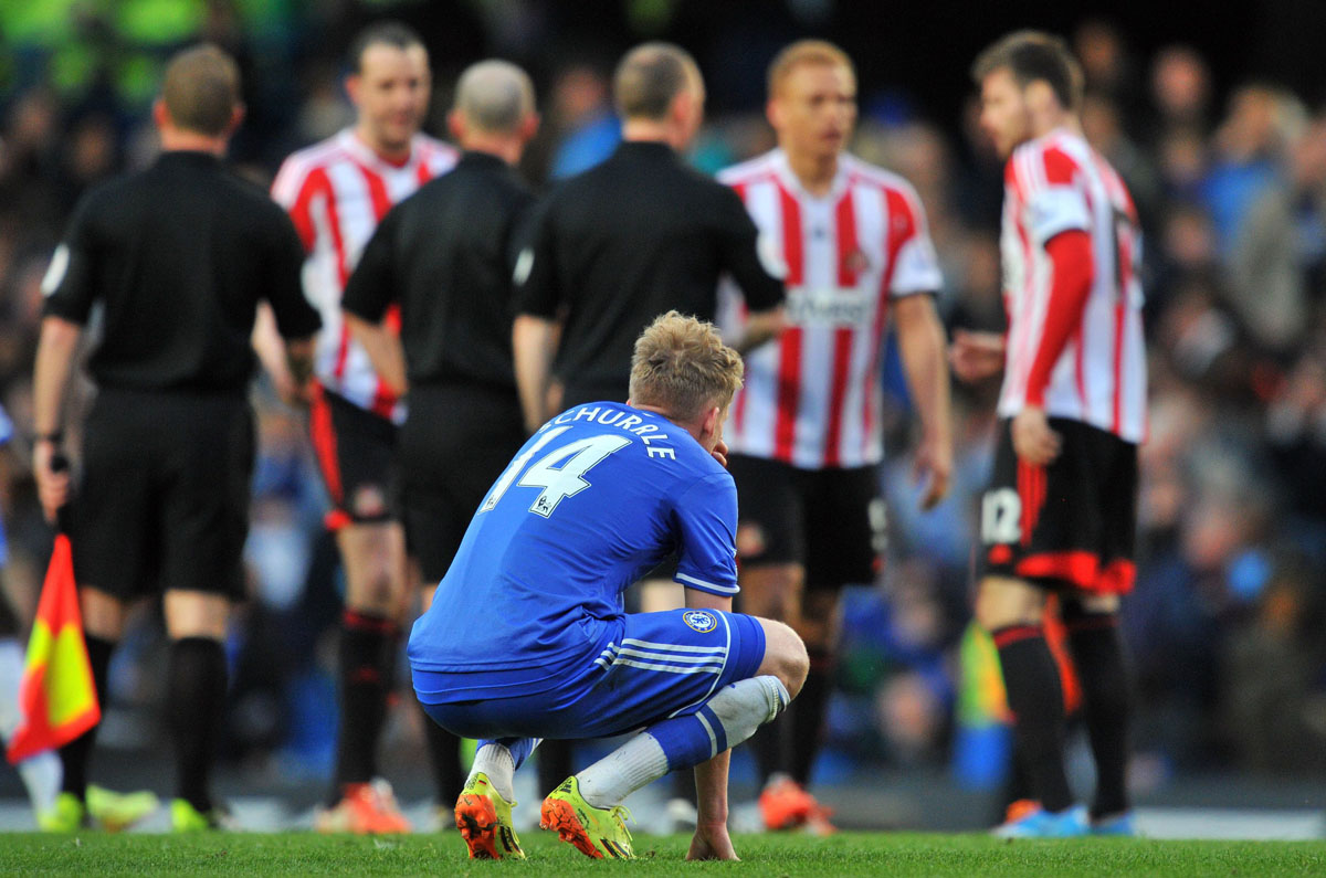 chelsea 039 s german midfielder andre schurrle foreground sinks after his team lost 1 2 during the english premier league football match between chelsea and sunderland at stamford bridge in london on april 19 2014 photo afp