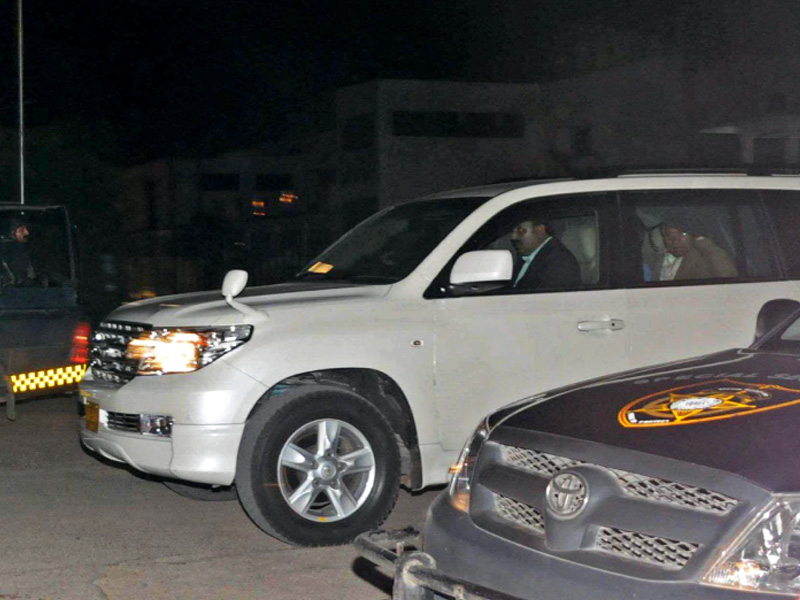 musharraf waves from his vehicle as he leaves karachi airport photo noman ahmad express