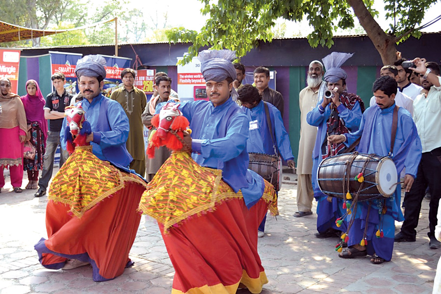 artists from punjab perform on the last day of the 10 day lok mela at shakarparian on sunday photo express