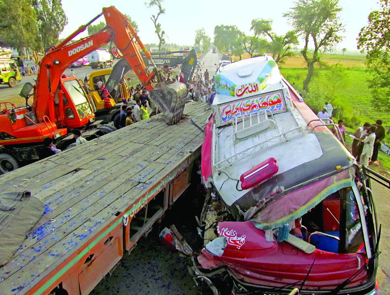 rescue workers attempt to pull passengers out of the bus after an accident with a trailer photo reuters