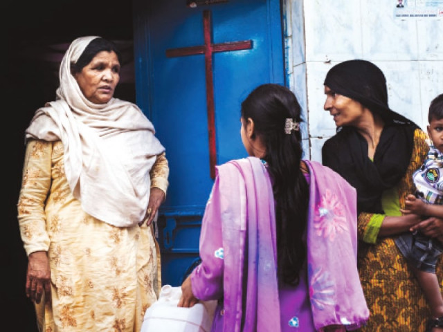 women exchange greetings outside the church in sector g 7 photo myra iqbal express women exchange greetings outside the church in sector g 7 photo myra iqbal express