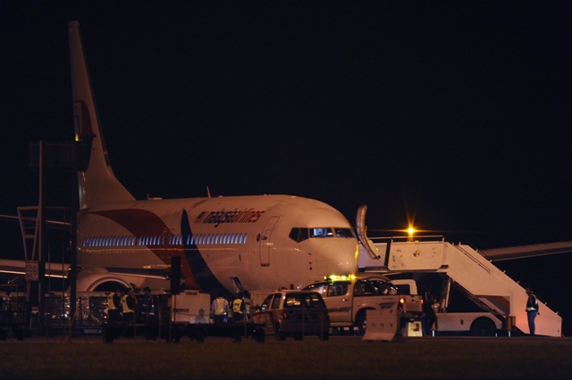 a malaysia airlines boeing 737 800 flight mh192 is seen on the tarmac after an emergency landing at the kuala lumpur international airport photo afp