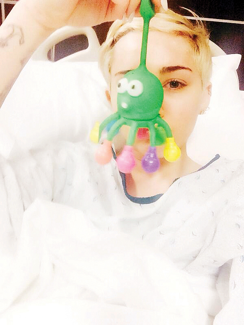 miley cyrus tweeted a picture of herself at the hospital playing with a stuffed animal photo file