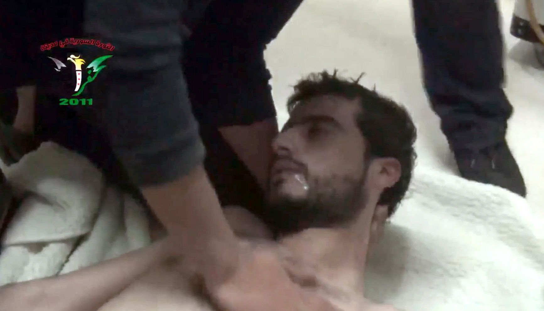 an image grab taken from a video released by the syrian activist group kafrzita shows a man being treated after purportedly chocking from inhaling poison released after a barrel bomb was allegedly dropped from an aircraft on april 12 2014 in karf zita in hama province new claims have emerged that president bashar al assad 039 s regime may have launched attacks with an industrial chemical earlier this month despite an international agreement to eliminate syria 039 s chemical arsenal on april 22 2014 photo afp