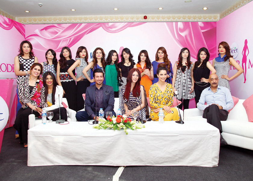 the entire team of the reality show including the aspiring models the host and the mentors photos publicity