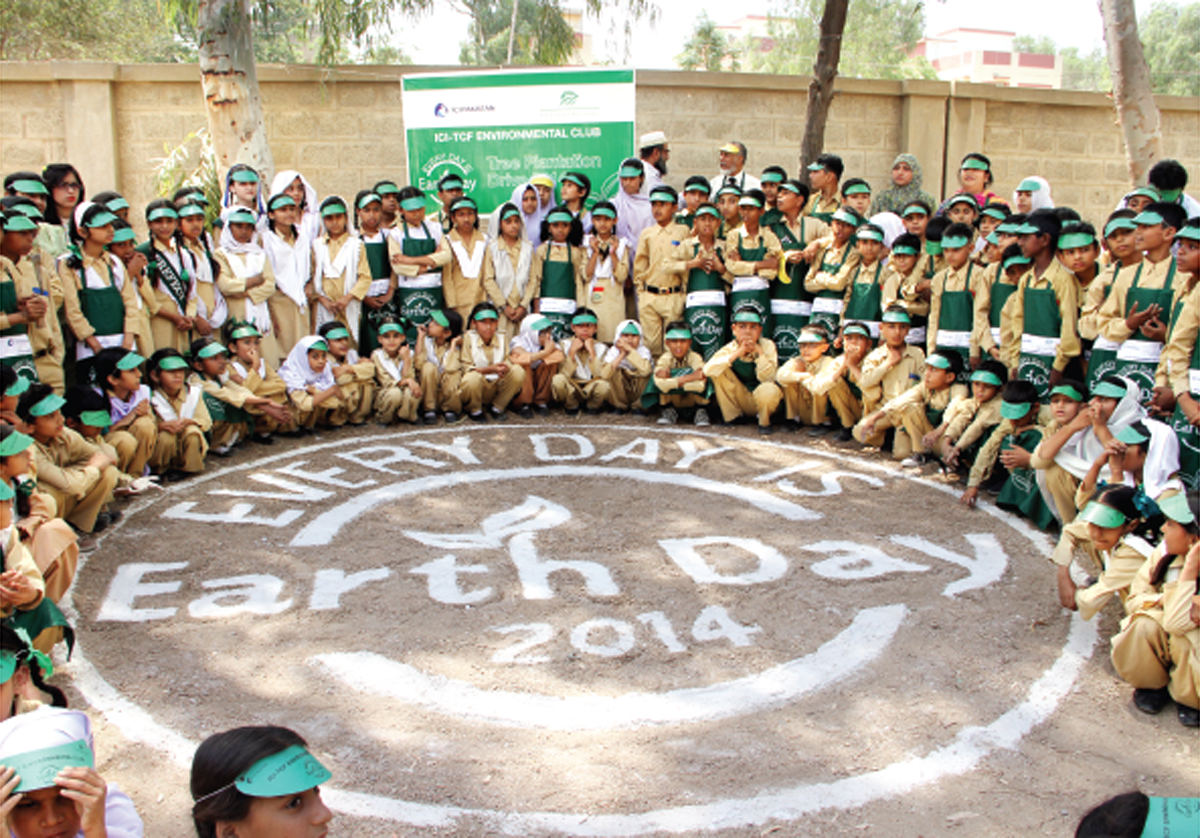 green is the way students of the citizens foundation take a photograph after the plantation drive at the tcf campus in saeedabad to celebrate the annual earth day on april 22 a total of 55 trees were planted by the students and volunteers photo press release