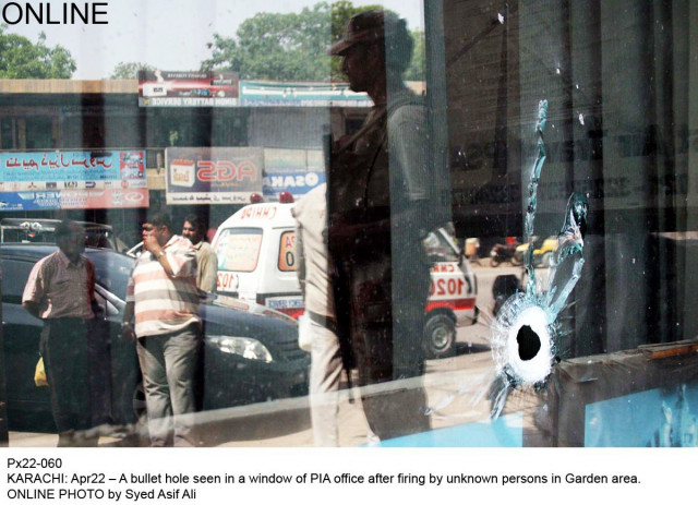 a ranger and an ambulance is reflected in the window of store which was shot at in garden area of karachi on tuesday photo online a ranger and an ambulance is reflected in the window of store which was shot at in garden area of karachi on tuesday photo online